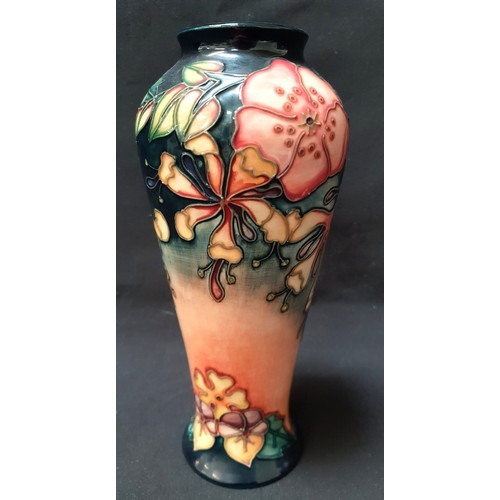 MOORCROFT POTTERY OBERON PATTERN VASE 
by Rachel Bishop, the vase of ovoid form and decorated with pastel pink and yellow flowers on top of a deep blue and washed pink ground, hand marked to underside "93 / WM", 21cm