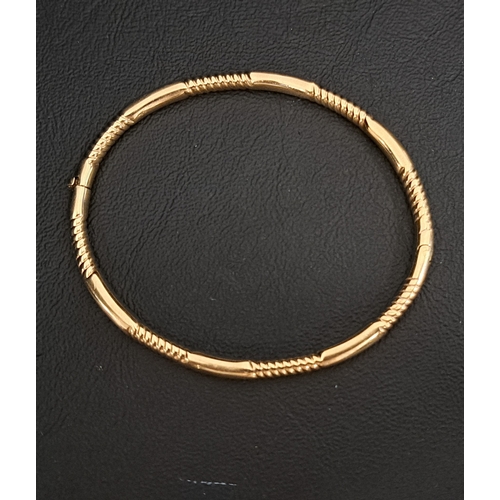 1 - NINE CARAT GOLD HINGED BANGLE
approximately 7.8 grams