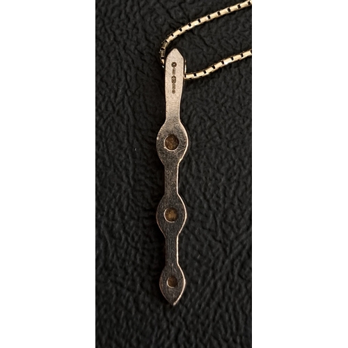 6 - DIAMOND THREE STONE PENDANT
the vertically set graduated diamonds totalling approximately 0.21cts, i... 