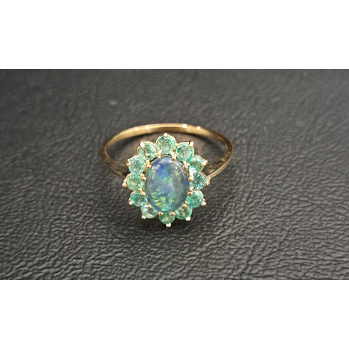21 - OPAL TRIPLET AND EMERALD CLUSTER RING
the central opal triplet approximately 8 x 6mm, in twelve peri... 