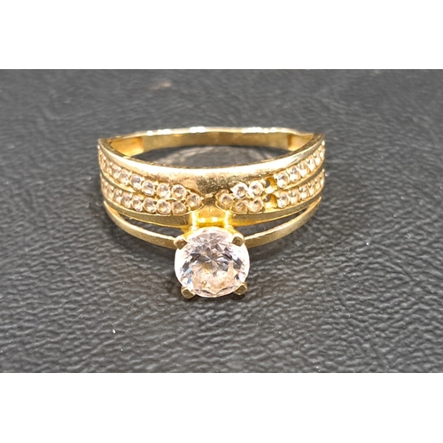 28 - CZ SET DRESS RING
in fourteen carat gold, ring size T and approximately 2.9 grams