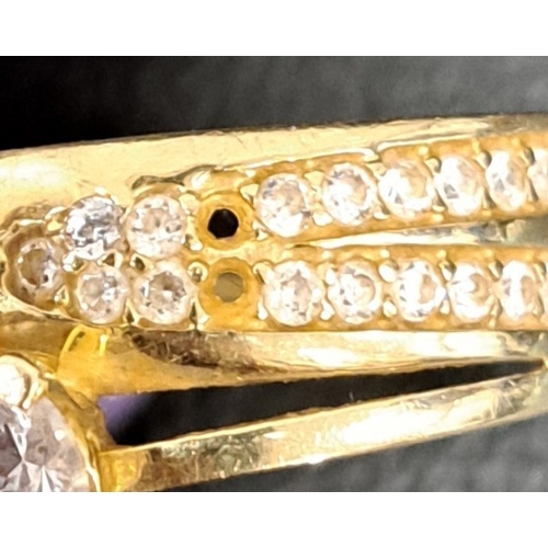 28 - CZ SET DRESS RING
in fourteen carat gold, ring size T and approximately 2.9 grams