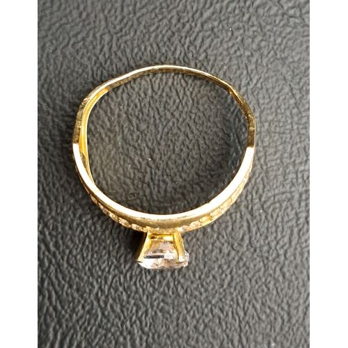 28 - CZ SET DRESS RING
in fourteen carat gold, ring size T and approximately 2.9 grams