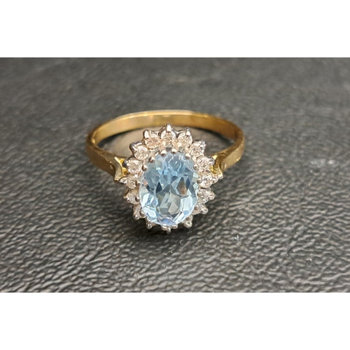 37 - BLUE TOPAZ AND DIAMOND CLUSTER RING
the central oval cut blue topaz approximately 1ct, in sixteen di... 