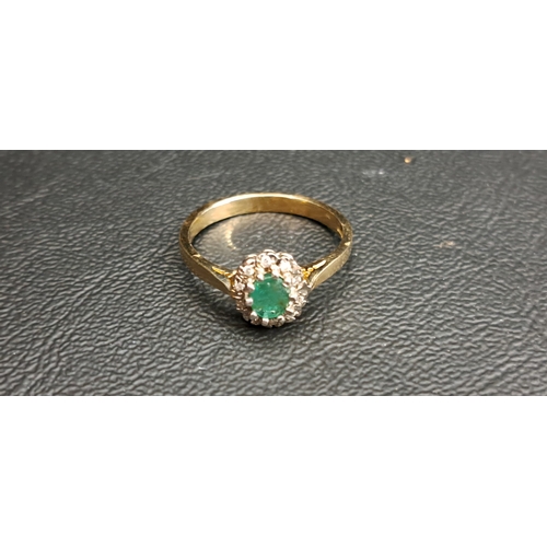 44 - EMERALD AND DIAMOND CLUSTER RING
the central oval cut emerald approximately 0.35cts, in ten diamond ... 