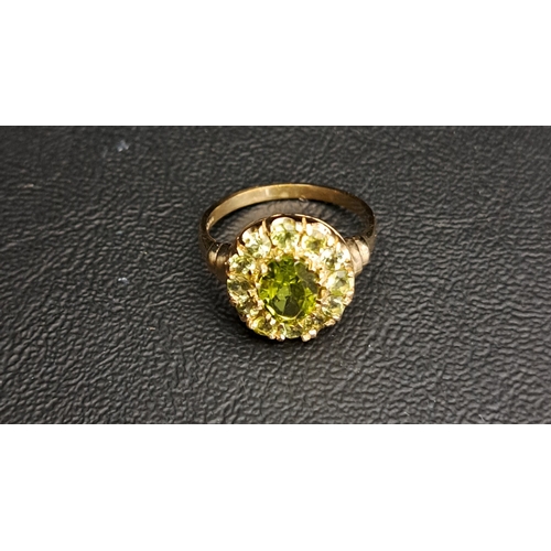 55 - PERIDOT CLUSTER RING
the central oval cut peridot approximately 1.5cts in twelve round cut peridot s... 