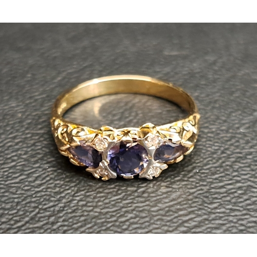 IOLITE AND DIAMOND RING
the central round cut iolite approximately 0.5cts, flanked by two small diamonds and a further pear cut iolite to each side, on nine carat gold shank, ring size N
