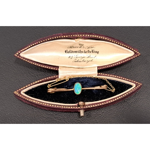 18 - OPAL SET BAR BROOCH
the oval cabochon opal measuring approximately 7 x 4mm, in unmarked nine carat g... 