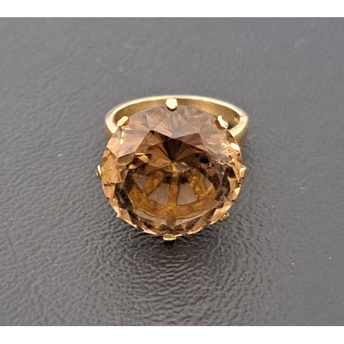 20 - LARGE SMOKY TOPAZ DRESS RING
the round cut topaz measuring approximately 16.7 x 16.7 x 10.3mm, on ni... 