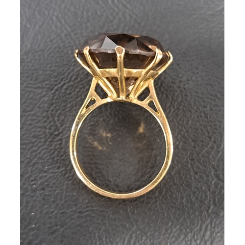 20 - LARGE SMOKY TOPAZ DRESS RING
the round cut topaz measuring approximately 16.7 x 16.7 x 10.3mm, on ni... 