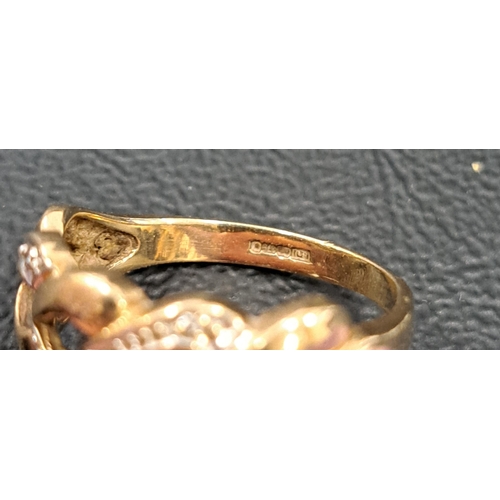39 - DIAMOND SET NINE CARAT GOLD RING
with pierced heart motif setting, ring size M and approximately 2.5... 