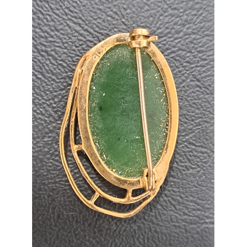 43 - JADE COLOURED HARDSTONE BROOCH
in nine carat gold mount, approximately 2.2 x 3.3cm