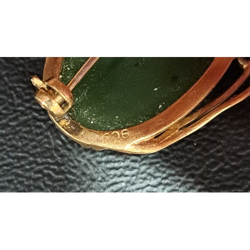 43 - JADE COLOURED HARDSTONE BROOCH
in nine carat gold mount, approximately 2.2 x 3.3cm