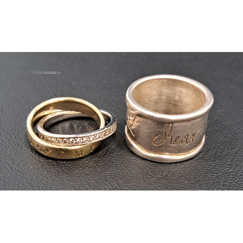 60 - TWO DESIGNER RINGS
comprising a 'Shawn Killinger - Hear my Soul Speak' silver ring; and an Emporio A... 