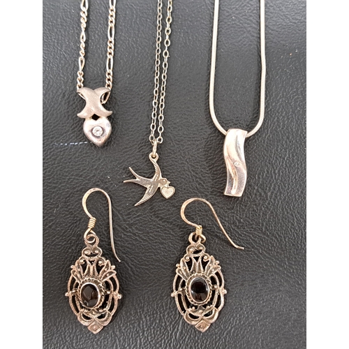 57 - SMALL SELECTION OF SILVER JEWELLERY
comprising three pendants on chains, one with a small flush set ... 