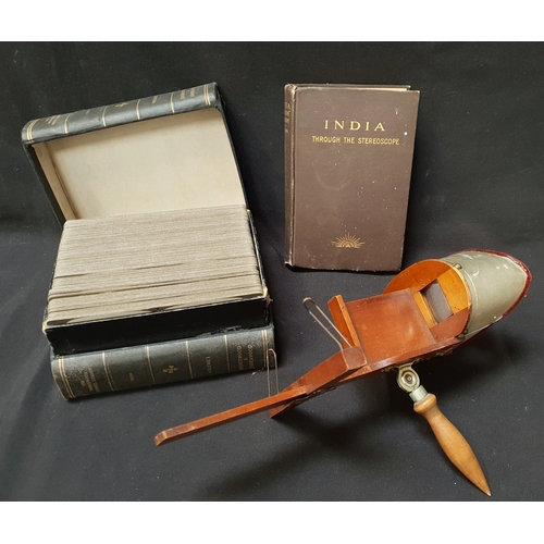 334 - EARLY 20th CENTURY STEREOSCOPE VIEWER 
with wooden body and folding handle and with velvet lined met... 