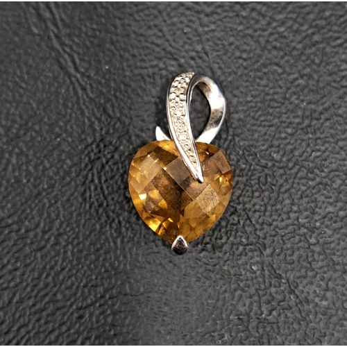 2 - SMOKY TOPAZ AND DIAMOND PENDANT
the heart shaped checkerboard topaz in diamond set nine carat white ... 