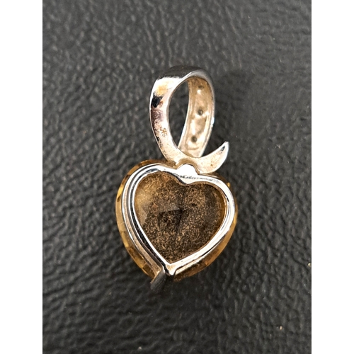 2 - SMOKY TOPAZ AND DIAMOND PENDANT
the heart shaped checkerboard topaz in diamond set nine carat white ... 