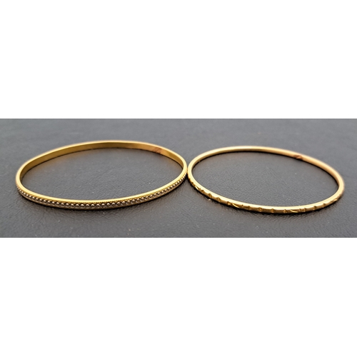 34 - TWO HIGH CARAT GOLD PLATED BANGLES
one marked 916, the other unmarked (2)