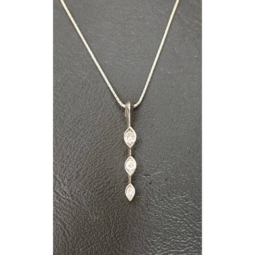 6 - DIAMOND THREE STONE PENDANT
the vertically set graduated diamonds totalling approximately 0.21cts, i... 