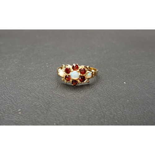 14 - GARNET AND OPAL CLUSTER DRESS RING
the central cabochon opal in six opal surround and with further o... 