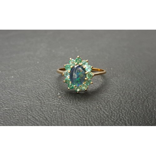 21 - OPAL TRIPLET AND EMERALD CLUSTER RING
the central opal triplet approximately 8 x 6mm, in twelve peri... 