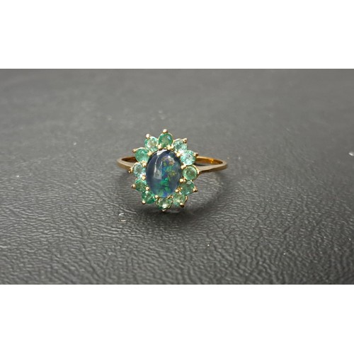 21 - OPAL TRIPLET AND EMERALD CLUSTER RING
the central opal triplet approximately 8 x 6mm, in twelve peri... 