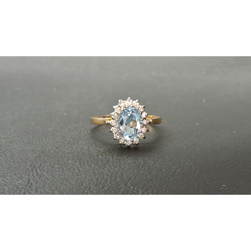 37 - BLUE TOPAZ AND DIAMOND CLUSTER RING
the central oval cut blue topaz approximately 1ct, in sixteen di... 