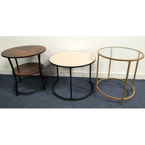 SELECTION OF THREE CONTEMPORARY OCCASIONAL TABLES
comprising a two-tiered side table, with matte black metal frame and dark wood rustic veneer to both surfaces, 54cm diameter and 55cm high; a light oak effect topped circular side table, 60cm diameter and 46cm high; and a glass topped circular side table with matte gilt coloured frame, 50cm diameter and 55cm high