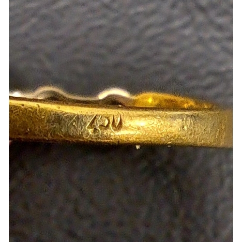 83 - DIAMOND SET EIGHTEEN CARAT GOLD RING
the four round and three baguette cut diamonds totalling approx... 