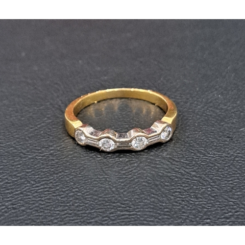 83 - DIAMOND SET EIGHTEEN CARAT GOLD RING
the four round and three baguette cut diamonds totalling approx... 