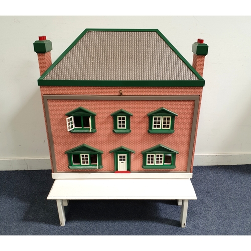346 - WOODEN CHILDREN'S DOLL HOUSE 
the exterior with a high-pitched roof, brick-style finish and green tr... 