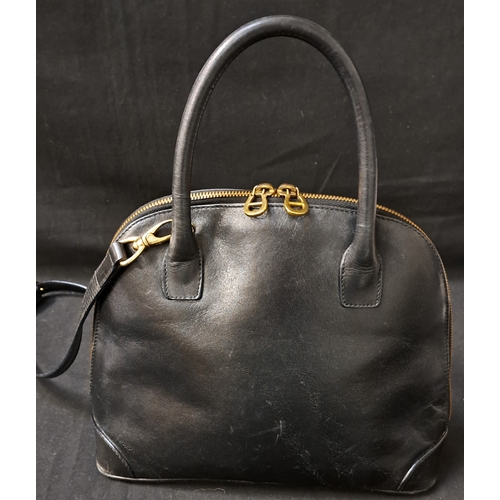 385 - AIGNER MUNICH BOWLER BAG
late 1980s, in black leather, gold-tone hardware, with dual top handles, a ... 