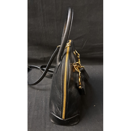 385 - AIGNER MUNICH BOWLER BAG
late 1980s, in black leather, gold-tone hardware, with dual top handles, a ... 