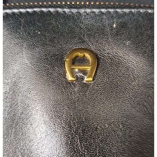 385 - AIGNER MUNICH BOWLER BAG
late 1980s, in black leather, gold-tone hardware, with dual top handles, a ... 