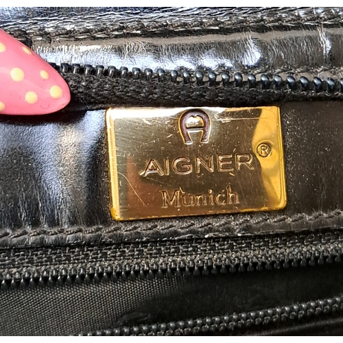 386 - AIGNER MUNICH SHOPPER TOTE BAG
early-to-mid 1990s, in black glossy leather, gold-tone hardware, with... 