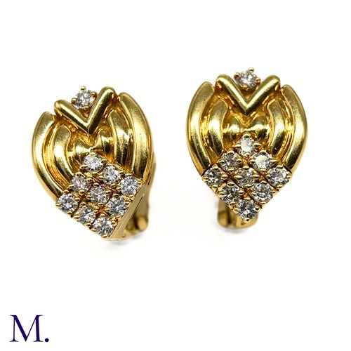 1 - A Pair of Diamond-Set Earclips by Mellerio

The 18ct yellow gold earclips are each set with 10 round... 