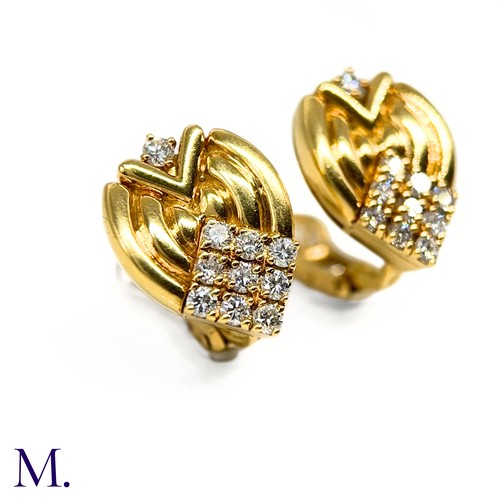 1 - A Pair of Diamond-Set Earclips by Mellerio

The 18ct yellow gold earclips are each set with 10 round... 