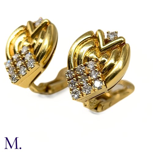 1 - A Pair of Diamond-Set Earclips by Mellerio

The 18ct yellow gold earclips are each set with 10 round... 