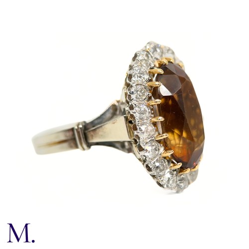 3 - A French Citrine and Diamond Cluster Ring

The French cluster ring is set with a oval-cut Madeira ci... 