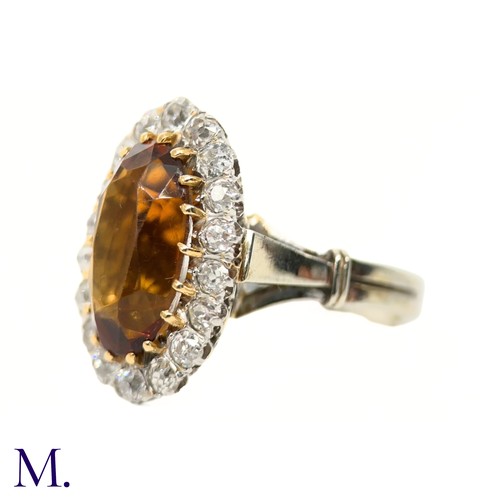 3 - A French Citrine and Diamond Cluster Ring

The French cluster ring is set with a oval-cut Madeira ci... 