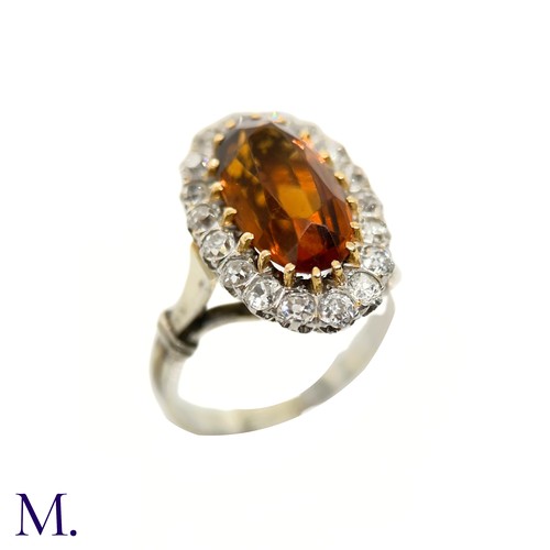 3 - A French Citrine and Diamond Cluster Ring

The French cluster ring is set with a oval-cut Madeira ci... 