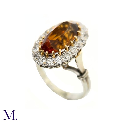 3 - A French Citrine and Diamond Cluster Ring

The French cluster ring is set with a oval-cut Madeira ci... 