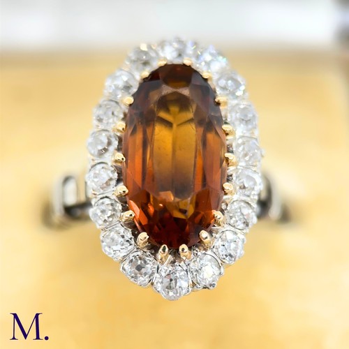 3 - A French Citrine and Diamond Cluster Ring

The French cluster ring is set with a oval-cut Madeira ci... 