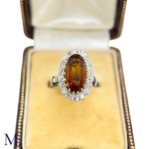 3 - A French Citrine and Diamond Cluster Ring

The French cluster ring is set with a oval-cut Madeira ci... 