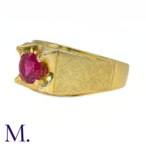 10 - An 18ct Gold and Ruby Ring

The heavy 18ct Gold ring is set with a round cut ruby (possibly syntheti... 