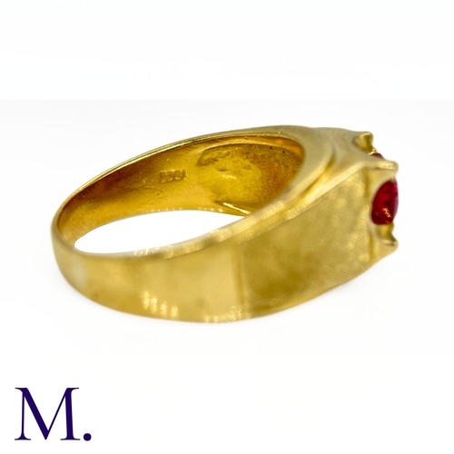 10 - An 18ct Gold and Ruby Ring

The heavy 18ct Gold ring is set with a round cut ruby (possibly syntheti... 