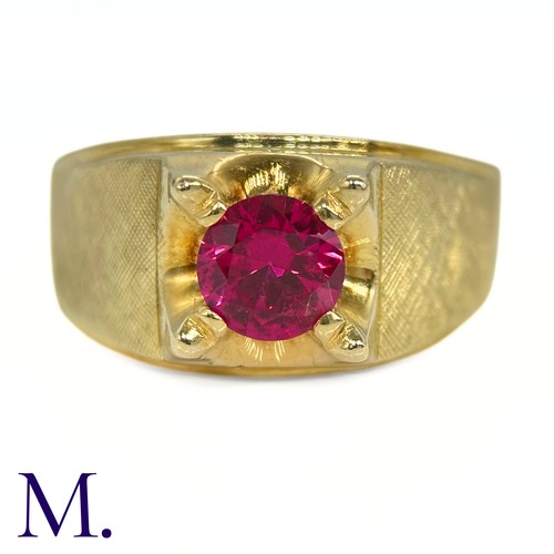 10 - An 18ct Gold and Ruby Ring

The heavy 18ct Gold ring is set with a round cut ruby (possibly syntheti... 