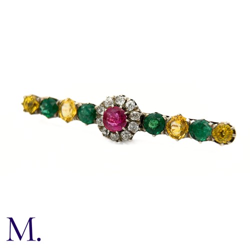 15 - An Antique Diamond, Ruby, Emerald and Yellow Sapphire Brooch.

The brooch is set with a ruby (untest... 