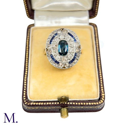 19 - A Sapphire and Diamond Cluster Ring

The 18ct gold ring is has a flat panel face set with an elongat... 